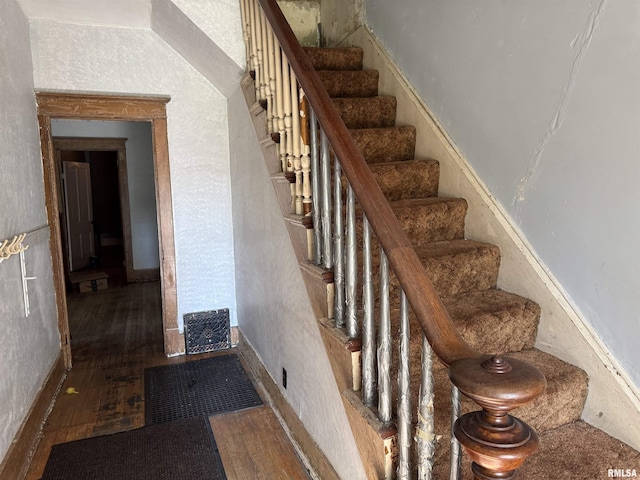 222 N Broadway St, Havana, IL 62644 - staircase featuring wood finished floors
