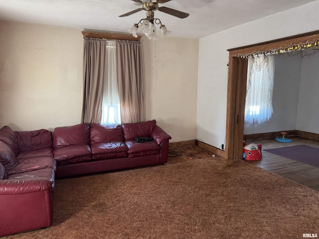 222 N Broadway St, Havana, IL 62644 - carpeted living room featuring ceiling fan and wood finished floors