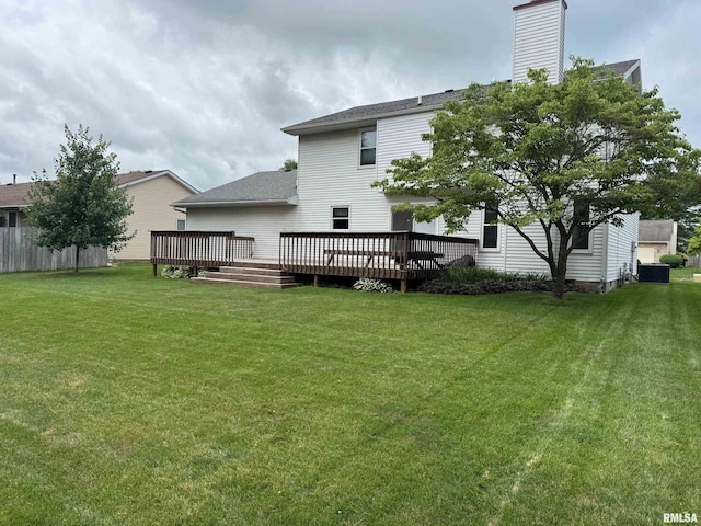 1804 Hunter Ridge Dr, Springfield, IL 62704 - rear view of property with a wooden deck, a yard, and a chimney