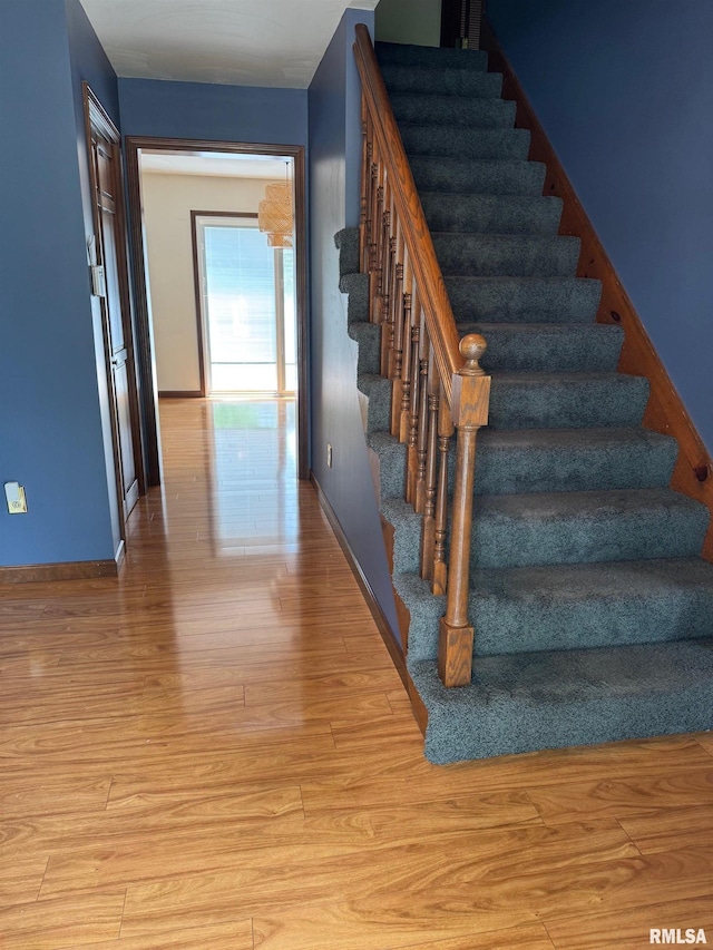 1804 Hunter Ridge Dr, Springfield, IL 62704 - staircase with wood finished floors and baseboards