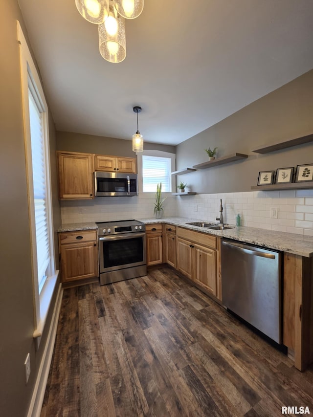 815 Washington St, Quincy, IL 62301 - kitchen with appliances with stainless steel finishes, open shelves, dark wood-type flooring, tasteful backsplash, and light stone counters
