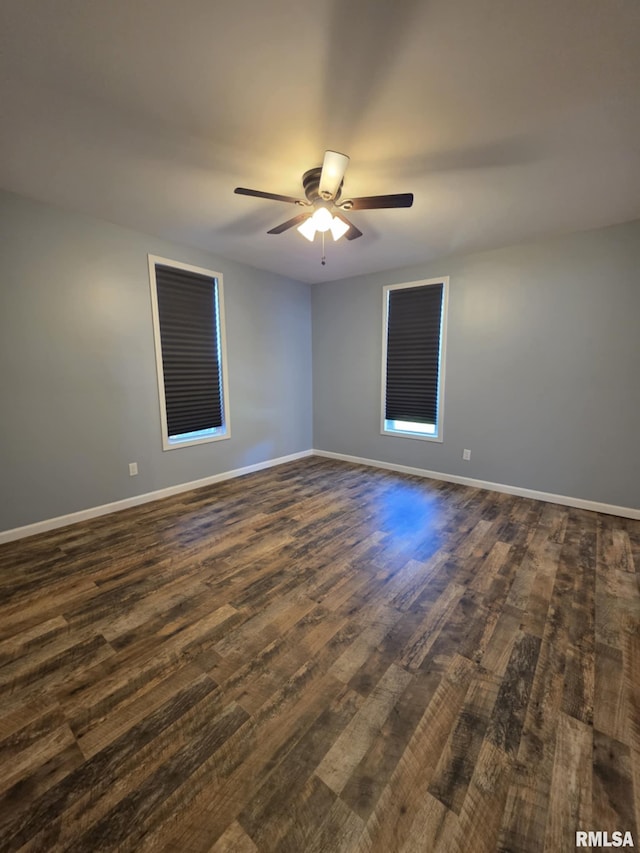 815 Washington St, Quincy, IL 62301 - empty room with dark wood-style floors and ceiling fan