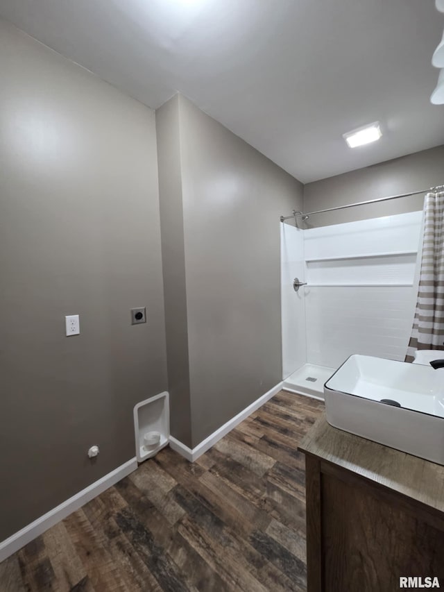 815 Washington St, Quincy, IL 62301 - washroom featuring dark wood finished floors and hookup for an electric dryer