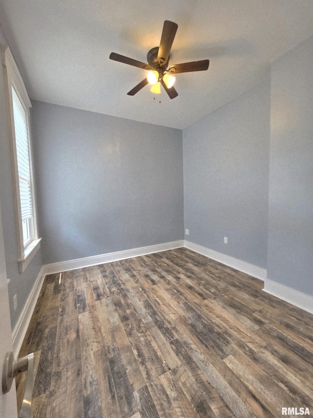815 Washington St, Quincy, IL 62301 - empty room with dark wood-style flooring, a ceiling fan, and plenty of natural light