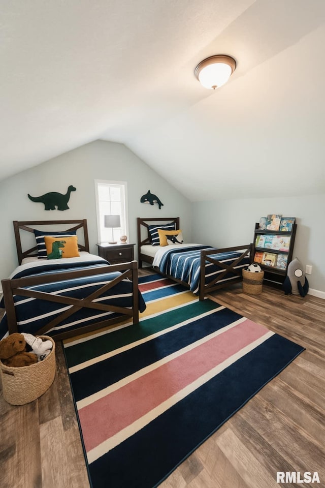 815 Washington St, Quincy, IL 62301 - bedroom featuring lofted ceiling and wood finished floors
