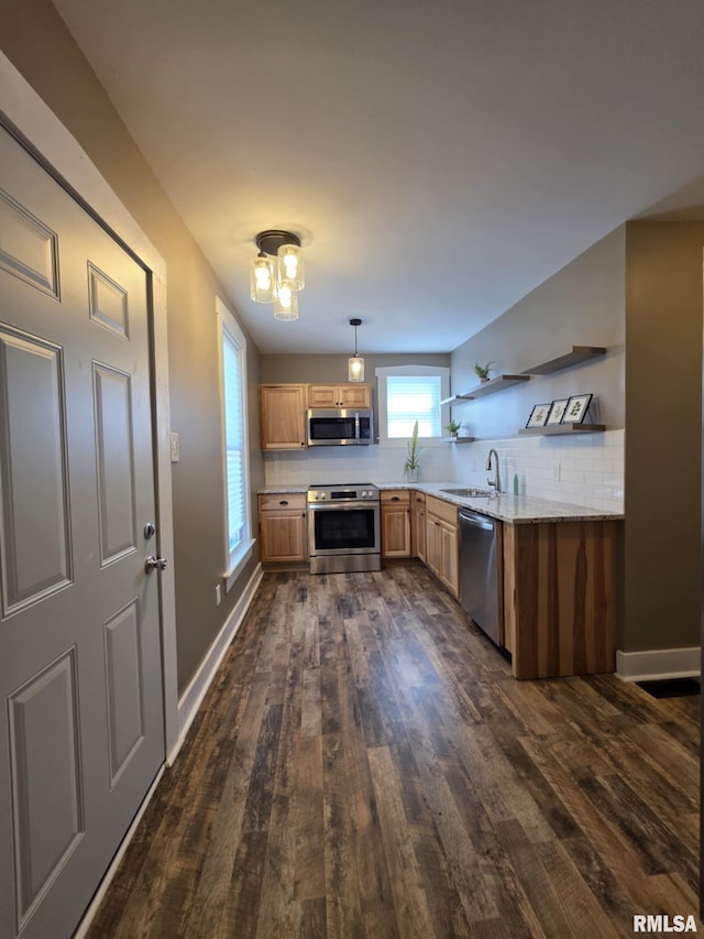 815 Washington St, Quincy, IL 62301 - kitchen featuring appliances with stainless steel finishes, open shelves, dark wood-type flooring, and light countertops