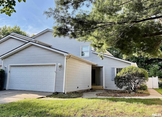 3205 Ashley Ln, Springfield, IL 62711 - view of front facade featuring an attached garage and concrete driveway