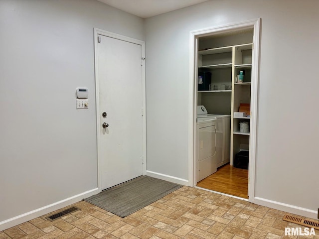 3205 Ashley Ln, Springfield, IL 62711 - entryway featuring separate washer and dryer and brick patterned floors