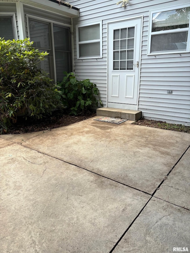 3205 Ashley Ln, Springfield, IL 62711 - view of exterior entry featuring a patio area