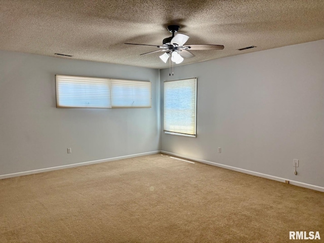 3205 Ashley Ln, Springfield, IL 62711 - carpeted spare room featuring a ceiling fan, plenty of natural light, and a textured ceiling