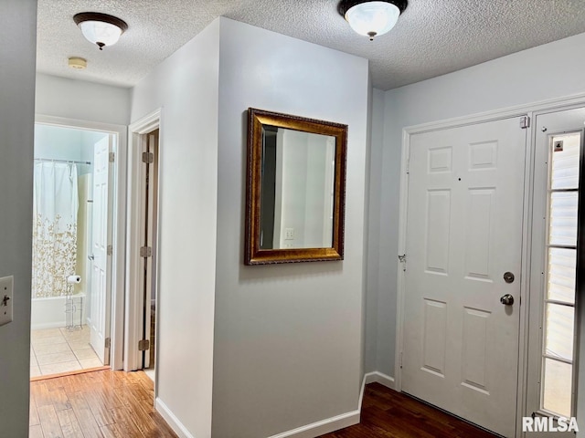 3205 Ashley Ln, Springfield, IL 62711 - entryway featuring a textured ceiling and wood finished floors