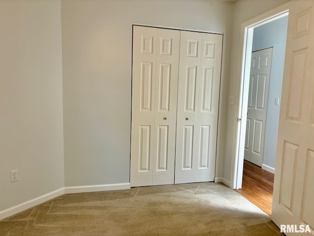 3205 Ashley Ln, Springfield, IL 62711 - unfurnished bedroom featuring carpet flooring and a closet