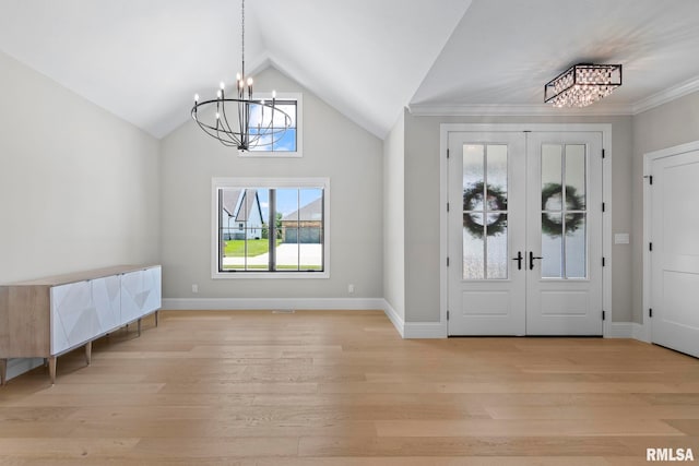 1811 Willow Bend St, Chatham, IL 62629 - entryway with a chandelier, light wood-type flooring, vaulted ceiling, french doors, and crown molding