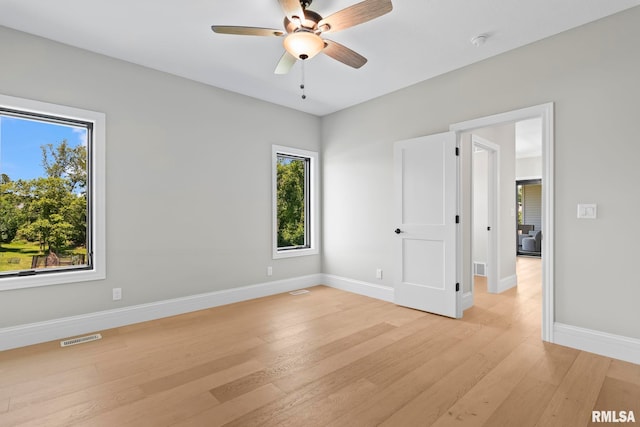 1811 Willow Bend St, Chatham, IL 62629 - spare room featuring light wood finished floors, a ceiling fan, and a smoke detector