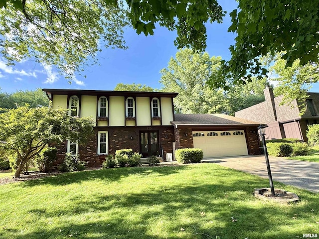 125 Pinehurst Dr, Springfield, IL 62704 - view of front of property featuring an attached garage, driveway, a front yard, and brick siding