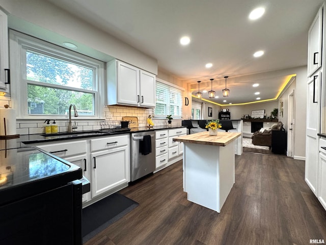 125 Pinehurst Dr, Springfield, IL 62704 - kitchen featuring dishwasher, butcher block counters, open floor plan, recessed lighting, and tasteful backsplash