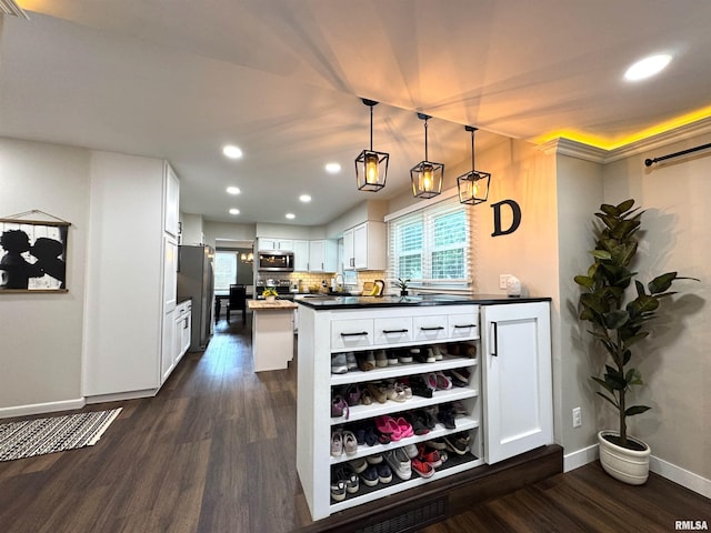 125 Pinehurst Dr, Springfield, IL 62704 - kitchen featuring appliances with stainless steel finishes, dark wood finished floors, recessed lighting, white cabinets, and dark countertops
