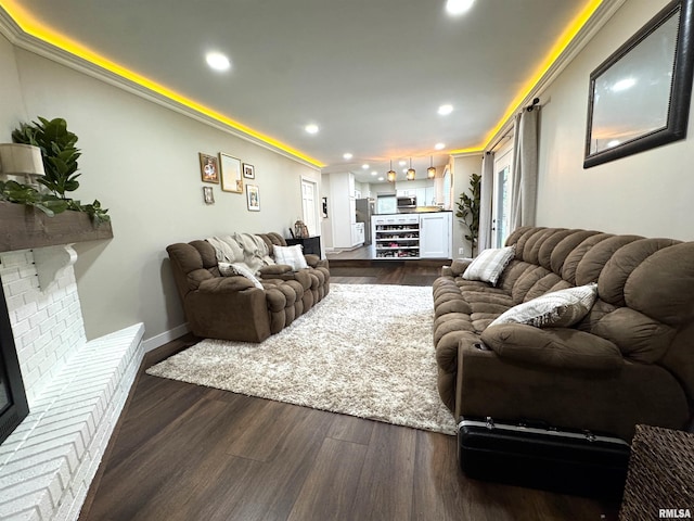125 Pinehurst Dr, Springfield, IL 62704 - living room featuring recessed lighting, dark wood-style flooring, wine cooler, and a fireplace