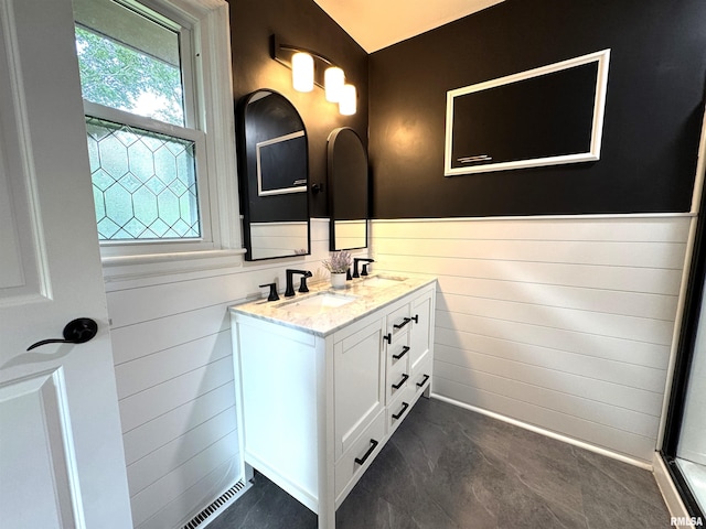 125 Pinehurst Dr, Springfield, IL 62704 - bathroom featuring double vanity, wainscoting, and wooden walls
