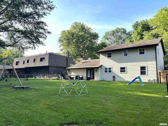 125 Pinehurst Dr, Springfield, IL 62704 - rear view of property with a fenced backyard and a playground