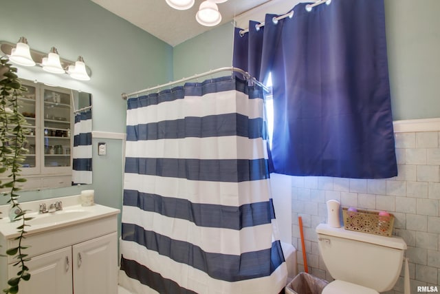 229 S 11th St, Quincy, IL 62301 - bathroom featuring vanity, tile walls, and curtained shower