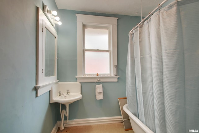 229 S 11th St, Quincy, IL 62301 - bathroom featuring baseboards and shower / bathtub combination with curtain