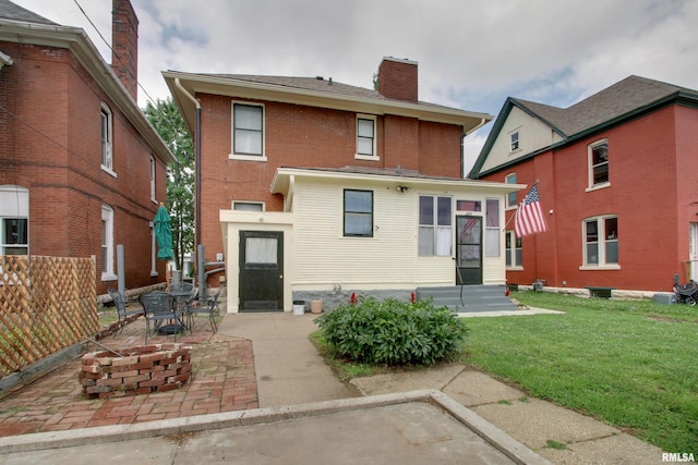 229 S 11th St, Quincy, IL 62301 - rear view of house featuring a chimney, a patio, and brick siding