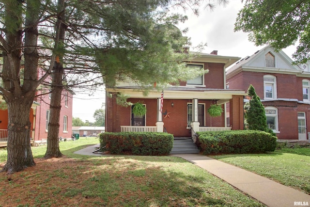 229 S 11th St, Quincy, IL 62301 - american foursquare style home featuring covered porch, brick siding, and a front yard
