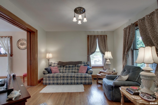 229 S 11th St, Quincy, IL 62301 - living area with plenty of natural light and wood finished floors