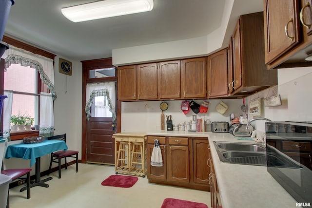 229 S 11th St, Quincy, IL 62301 - kitchen with brown cabinetry and light countertops