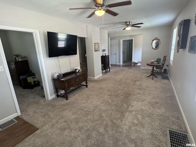 1637 Spruce St, Quincy, IL 62301 - carpeted living room with a ceiling fan and baseboards