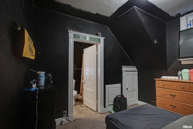 1412 Oak St, Quincy, IL 62301 - carpeted bedroom featuring lofted ceiling and ensuite bathroom