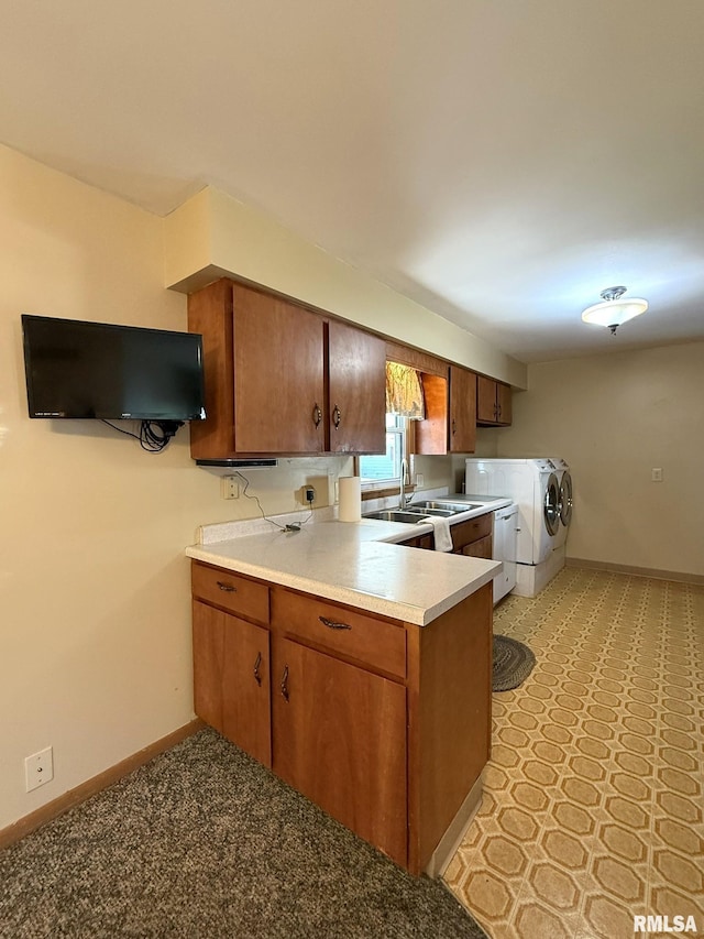 903 N Fearing Ave, Abingdon, IL 61410 - kitchen featuring separate washer and dryer, brown cabinets, a peninsula, light countertops, and dishwasher