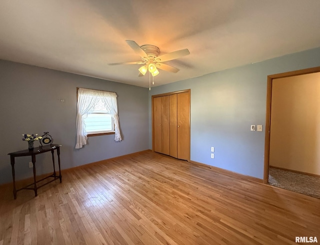 903 N Fearing Ave, Abingdon, IL 61410 - unfurnished bedroom with light wood-type flooring, a closet, and ceiling fan