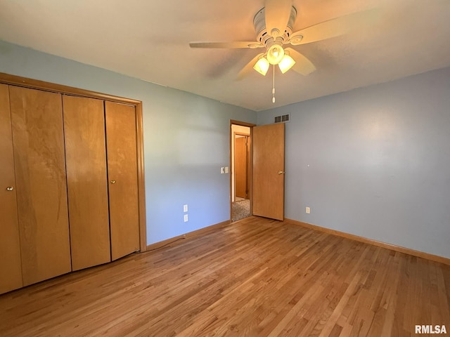 903 N Fearing Ave, Abingdon, IL 61410 - unfurnished bedroom with light wood-type flooring, a closet, and ceiling fan