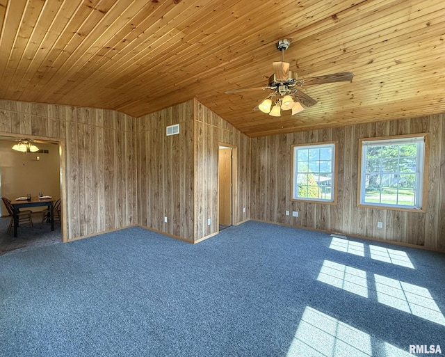 903 N Fearing Ave, Abingdon, IL 61410 - unfurnished room featuring ceiling fan, wood ceiling, carpet, wood walls, and vaulted ceiling