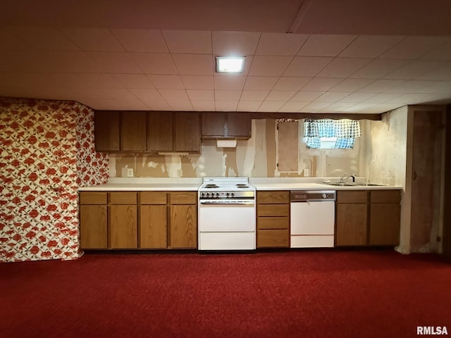 903 N Fearing Ave, Abingdon, IL 61410 - kitchen featuring white appliances, light countertops, brown cabinets, and dark carpet