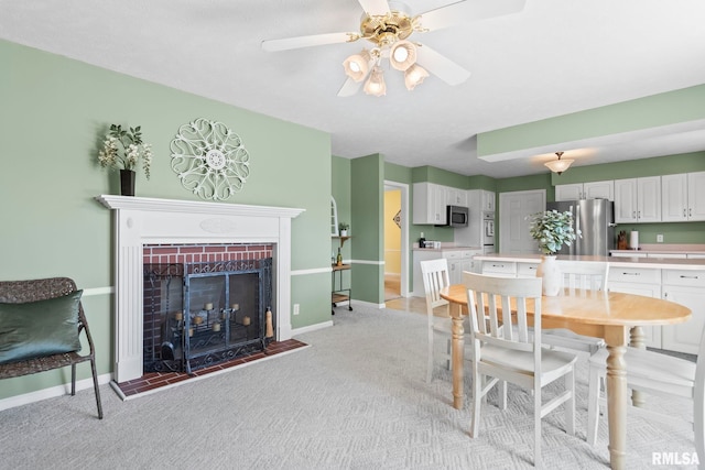 1860 Mayfield Rd, Chatham, IL 62629 - dining space featuring light colored carpet, ceiling fan, and a fireplace with raised hearth