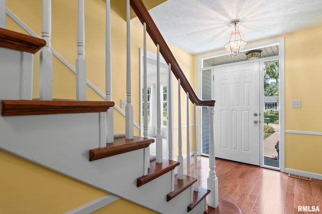 1860 Mayfield Rd, Chatham, IL 62629 - entryway featuring stairway, wood finished floors, and a chandelier