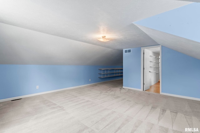 1860 Mayfield Rd, Chatham, IL 62629 - additional living space featuring carpet, lofted ceiling, and a textured ceiling