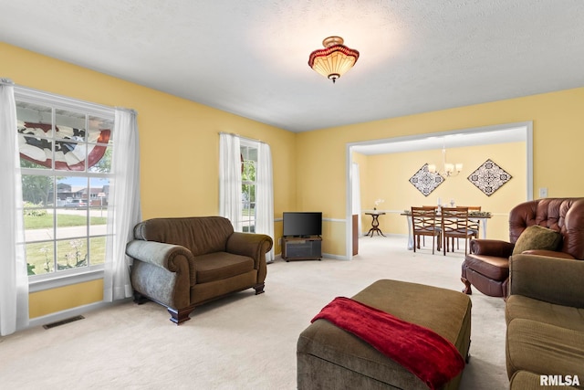 1860 Mayfield Rd, Chatham, IL 62629 - living room with a chandelier, healthy amount of natural light, and light colored carpet