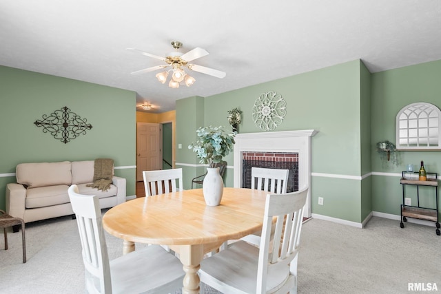 1860 Mayfield Rd, Chatham, IL 62629 - dining space with carpet flooring, ceiling fan, and a brick fireplace