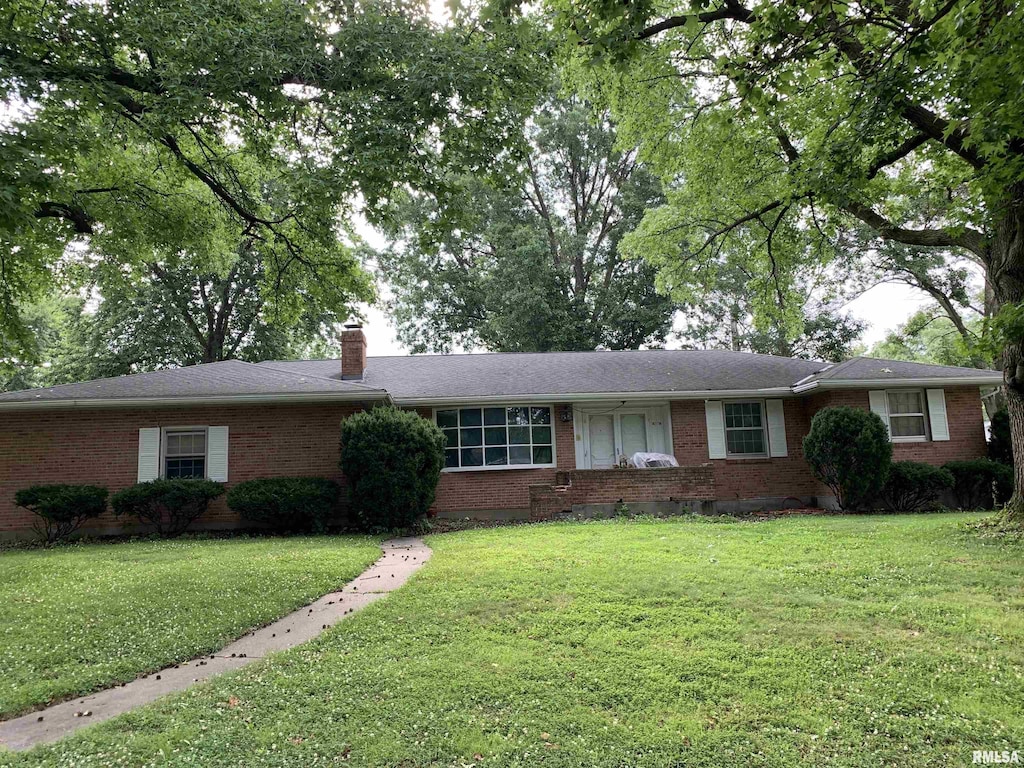 1629 Curtis Creek Rd, Quincy, IL 62301 - ranch-style home with brick siding, a front yard, and a chimney