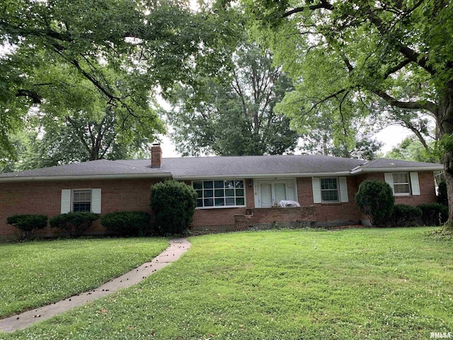 1629 Curtis Creek Rd, Quincy, IL 62301 - ranch-style home with brick siding, a front yard, and a chimney