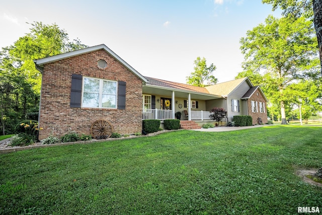 623 Jasper Rd, Centralia, IL 62801 - single story home with covered porch, brick siding, and a front lawn