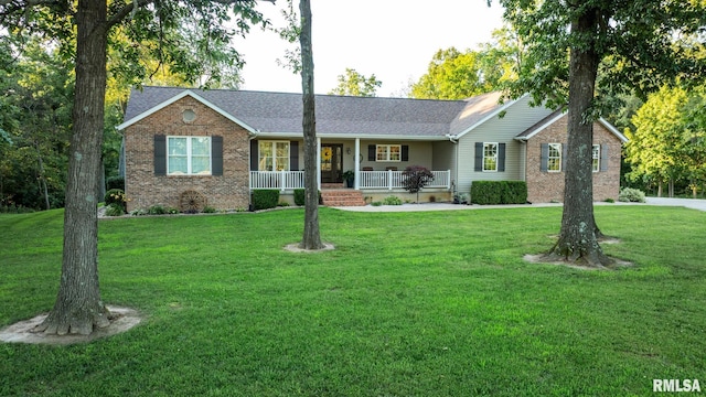 623 Jasper Rd, Centralia, IL 62801 - single story home featuring a porch, brick siding, a front yard, and roof with shingles