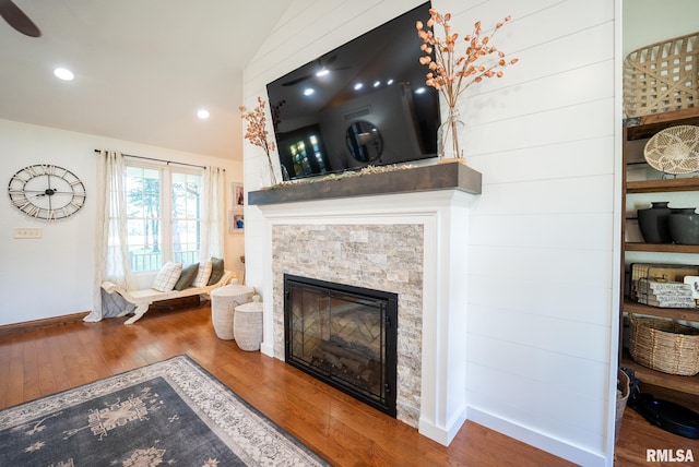623 Jasper Rd, Centralia, IL 62801 - living area featuring lofted ceiling, a stone fireplace, wood finished floors, and recessed lighting