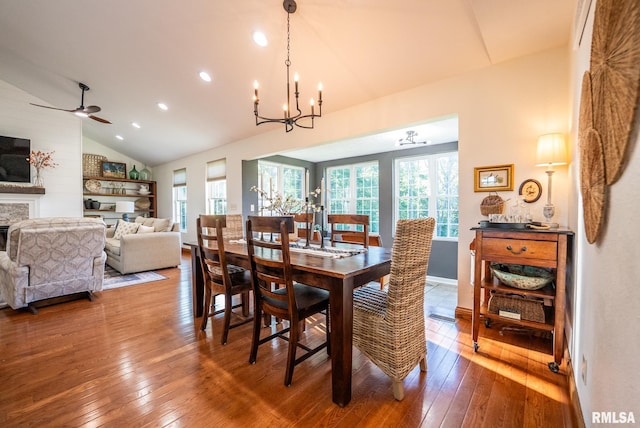 623 Jasper Rd, Centralia, IL 62801 - dining area featuring plenty of natural light, lofted ceiling, wood-type flooring, a chandelier, and a fireplace