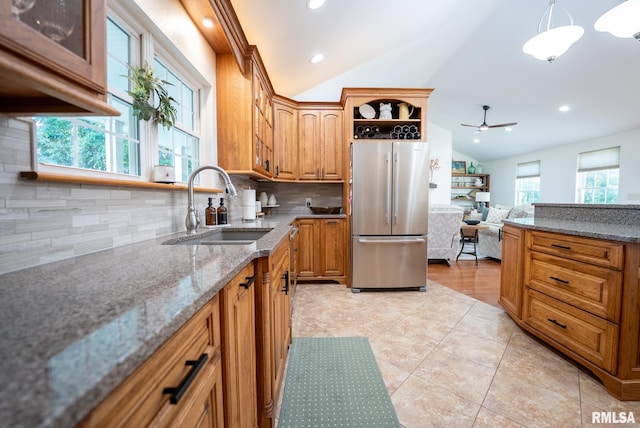 623 Jasper Rd, Centralia, IL 62801 - kitchen with freestanding refrigerator, lofted ceiling, backsplash, a ceiling fan, and stone countertops