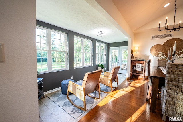 623 Jasper Rd, Centralia, IL 62801 - dining space featuring a chandelier, wood finished floors, and vaulted ceiling